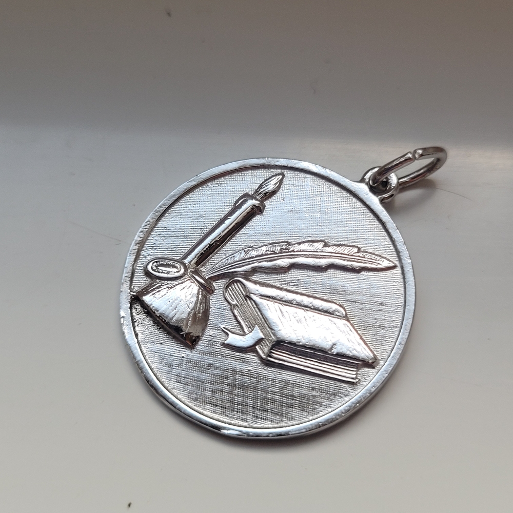Writer silver pendant